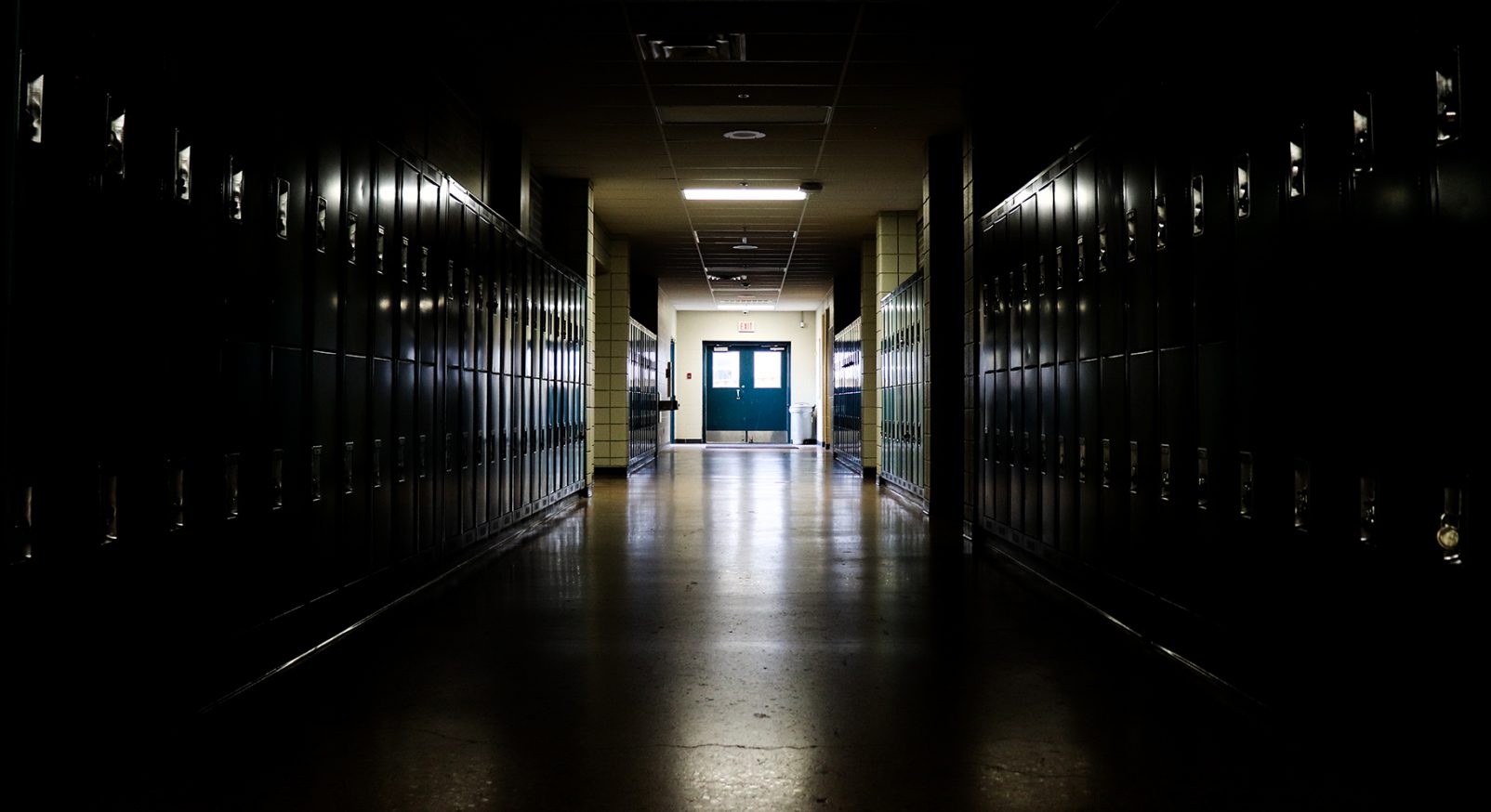 School,Hallway,With,Deep,Shadows,Sinking,Into,The,Various,Rows